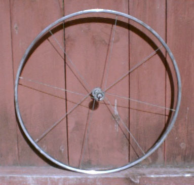 bicycle rim held together with eight evenly-distributed spokes