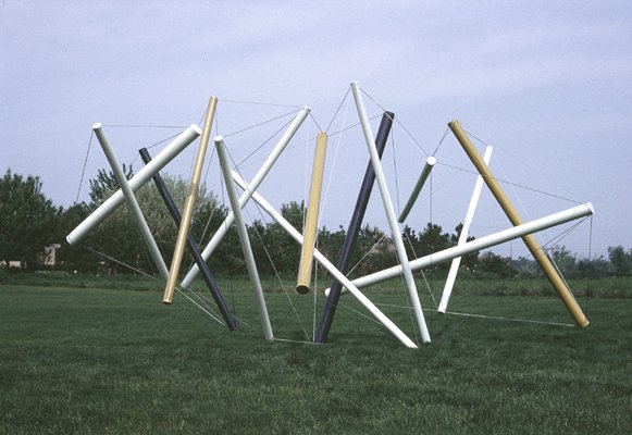 photo of multi-colored Snelson sculpture outdoors on a lawn