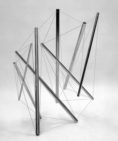 photo portrait of stainless-steel Snelson sculpture indoors