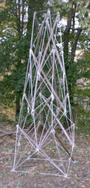 four-fold garden-stake-and-nylon-twine tensegrity obelisk standing outdoors